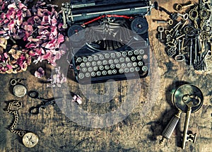 Antique typewriter hortensia flowers old keys wooden table