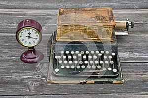 Antique typewriter, vintage clock and old book Bible