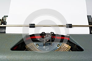 Antique Typewriter on White Background with Paper Close Up