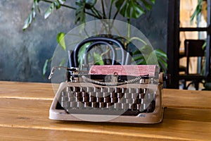 Antique typewriter on wooden table