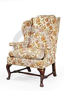 Antique upholstered wing arm chair  isolated on white