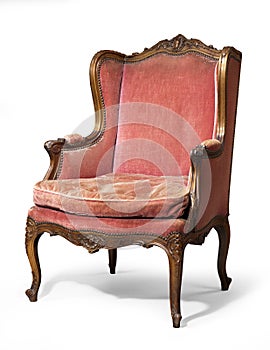 Antique upholstered wing chair photo
