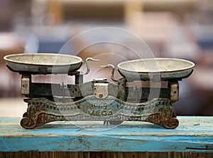 Antique vintage balance old scales on a wooden surface