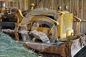 Antique Vintage Bulldozer Stored in an Old Rustic Barn