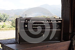 Antique vintage collectible transistor radio on the table.