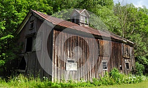 Antique vintage wooden barn set in countryside