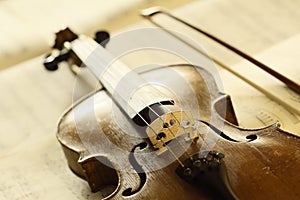 Antique violin with fiddlestick photo