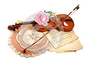 Antique violin, notes and peon