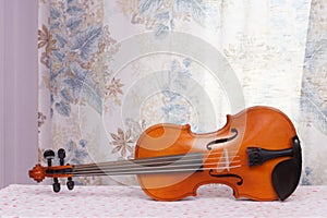 Antique violin for restoration on a table apart sides
