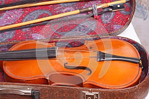 Antique violin for restoration on a table apart sides