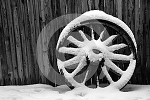Antique Wagon Wheel with Snow