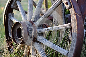 Antique wagon wheel at sunset