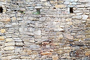 Antique wall made of natural stone. Ancient culture