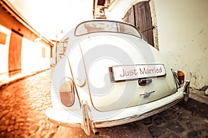 Antique wedding car with just married sign