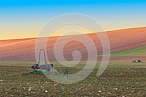 Antique well in field