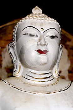 Antique white Buddha Portrait with prominent golden third eye
