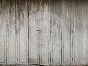 Antique white wooden doors with old and external architecture