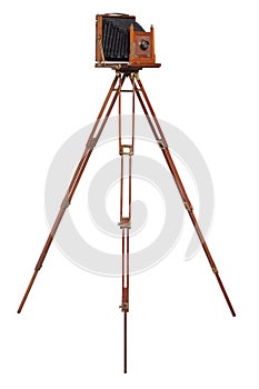 An antique wood camera on an old wooden tripod isolated on white