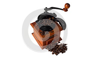 Antique wooden coffee grinder with coffee beans