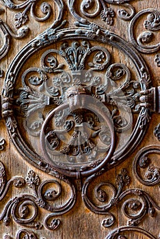Antique wooden door with metal elements