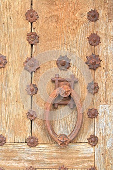 Antique wooden door with a very heavy metal doorknob