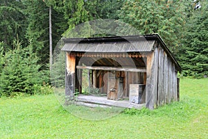 Antique wooden hives in an apiary in the forest