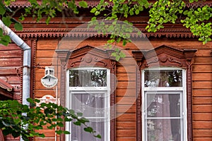 Antique wooden house in Old Town city. wooden house with beautiful carved platbands