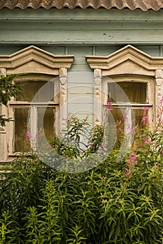 Antique wooden house in Old Town city. wooden house with beautiful carved platbands