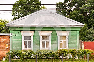 Antique wooden house in Old Town city. wooden house with beautiful carved platbands