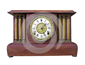 Antique wooden mantle clock isolated.