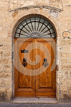 Antique wooden door San Gimignano, Siena, Tuscany, Italy