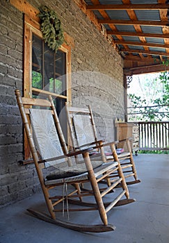 Antique wooden rocking chair on farmhouse porch