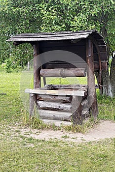 Antique wooden water well stock photo