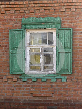 Antique wooden windows carved platbands in the village
