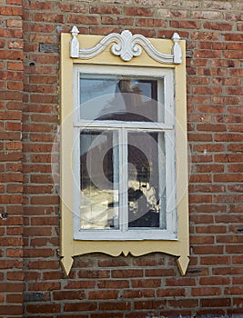 Antique wooden windows carved platbands in the village