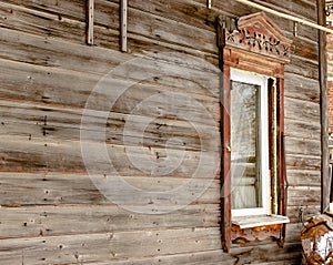 Antique wooden windows carved platbands in the village