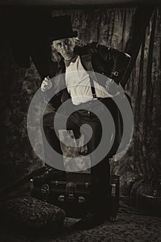 Antiqued steampunk portrait of man standing