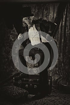 Antiqued steampunk portrait of man standing photo