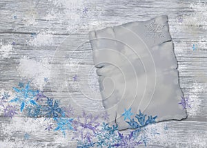 Antiqued Wooden Background with Aged Torn Paper Page and Snowflake Decoration.