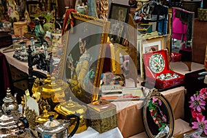 Antiquities at flea market, selection of vintage things, antique stuff