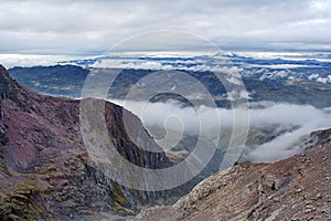 Antisana Volcano rising above a valley