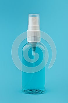 antiseptic on a blue background, sanitizer in medicine protection against viruses and bacteria. small and comfortable
