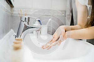 Antiseptic hand washing procedure with soap and water in bathroom.Decontamination steps of hand hygiene routine.Cleaning hands,