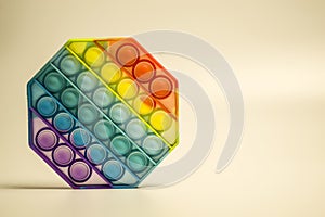 Antistress toy pop it fidget on yellow background. photo