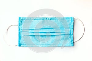 Antiviral blue medical mask for protection against coronavirus. Surgical protective mask on white background. prevention of the