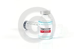 Antiviral vaccine bottle and medical Syringe on white background
