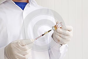 Antiviral vaccine vial in hands of a doctor.