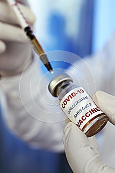 Antiviral vaccine vial in hands of a doctor.