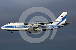 Antonov Heavy An124 Cargo Freighter Aircraft landing in stormy blue sky