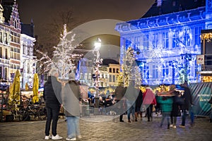 People at the Christmas markert in Grote Markt square in Antwerp, Belgium, at night